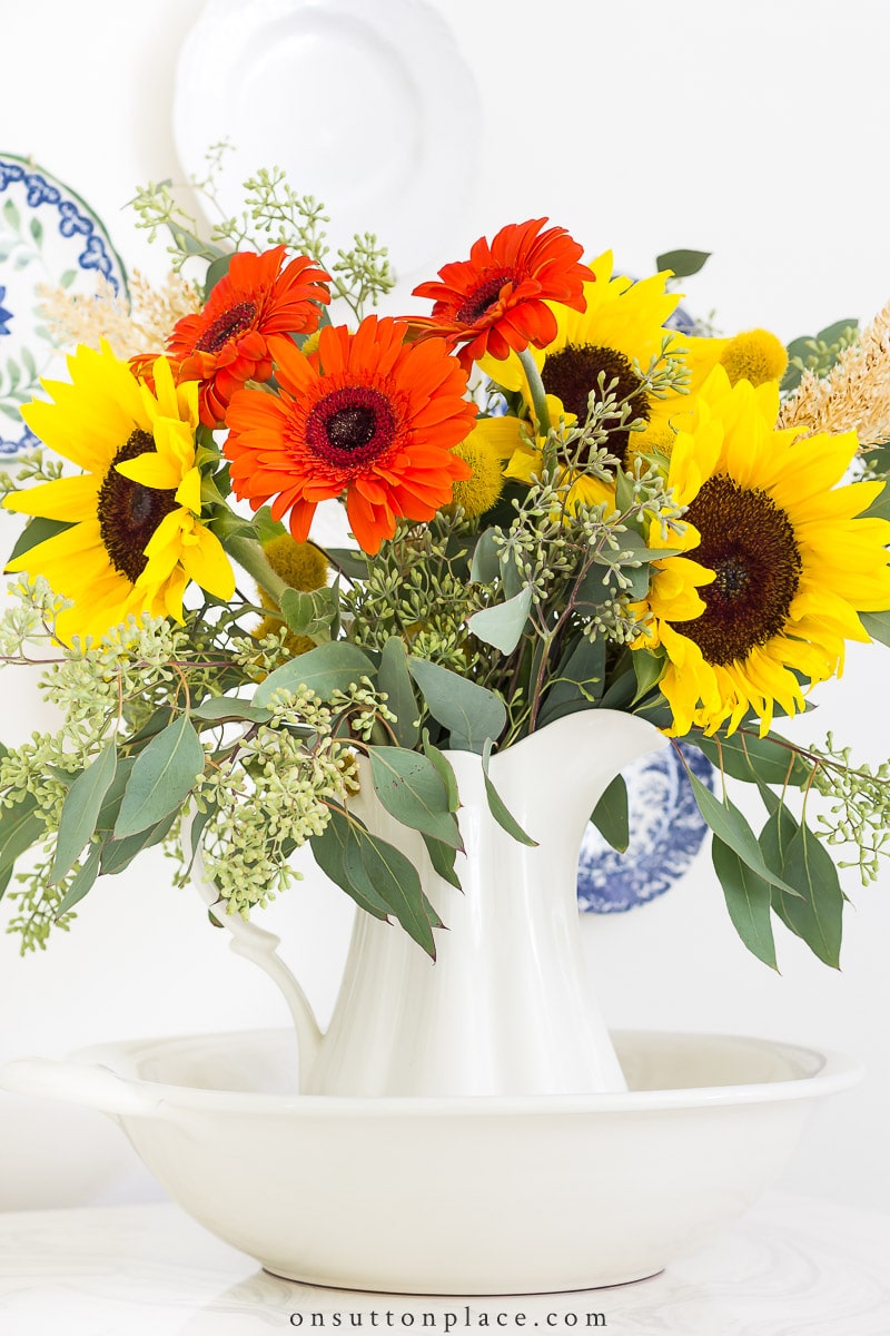 fall flowers in pitcher and bowl on sutton place